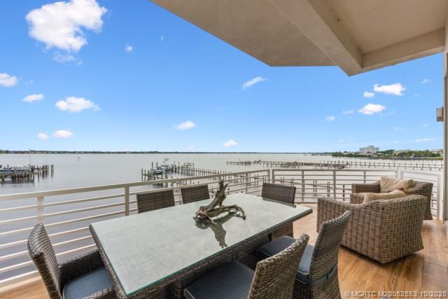 51 Southeast Seminole Street, Unit 305 Stuart, FL 34994 - Photo 19 of 47 a view of a terrace with furniture