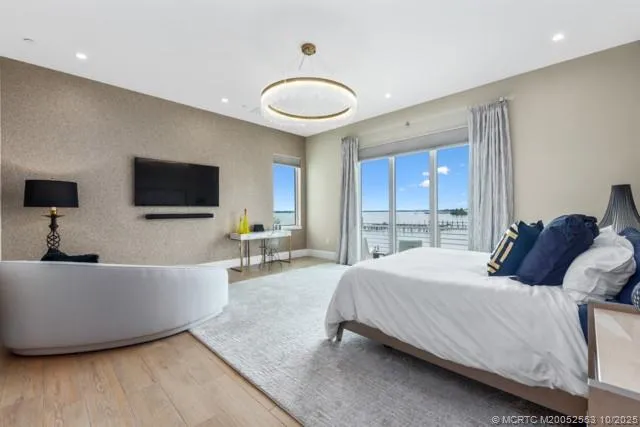 a bedroom with a bed and a couch