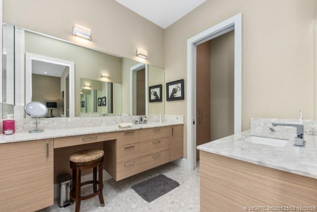 51 Southeast Seminole Street, Unit 305 Stuart, FL 34994 - Photo 26 of 47 a bathroom with a granite countertop sink and a mirror