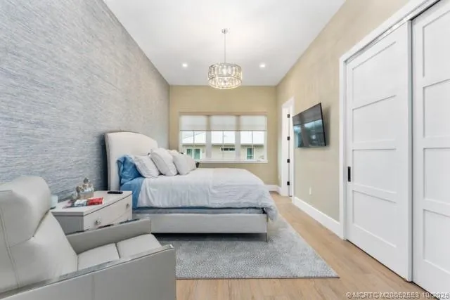 a bathroom with a granite countertop bathtub shower sink vanity mirror and toilet