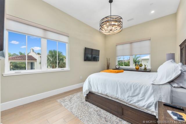 51 Southeast Seminole Street, Unit 305 Stuart, FL 34994 - Photo 33 of 47 a bedroom with a bed and window