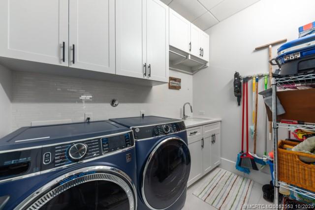 51 Southeast Seminole Street, Unit 305 Stuart, FL 34994 - Photo 35 of 47 a utility room with dryer and washer