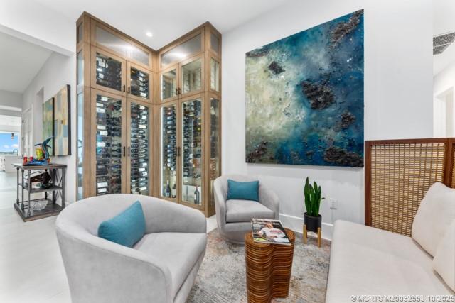 51 Southeast Seminole Street, Unit 305 Stuart, FL 34994 - Photo 8 of 47 a living room with furniture and a potted plant