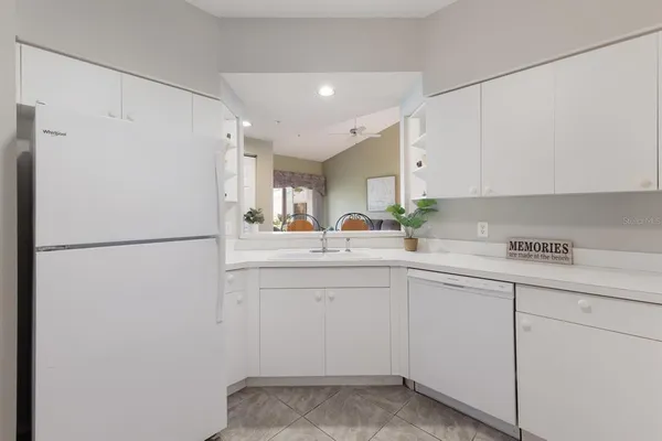a kitchen with a sink and a refrigerator