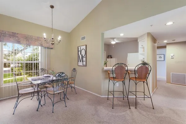 a dining room with furniture and window
