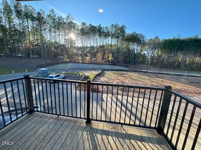 a view of balcony with wooden floor