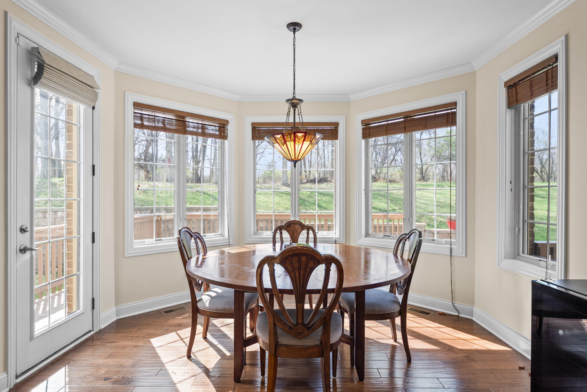 9080 Winding Trail St. John, IN 46373 - Photo 15 of 34 a view of a dining room with furniture window and wooden floor