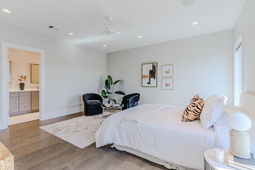 247 D Street, Unit 8 Boston, MA 02127 - Photo 31 of 42 a bedroom with a bed and a wooden floor