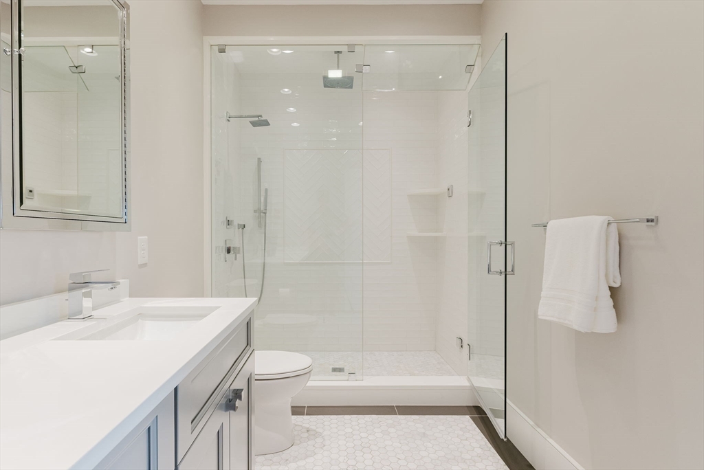 247 D Street, Unit 8 Boston, MA 02127 - Photo 35 of 42 a bathroom with a sink a toilet and shower