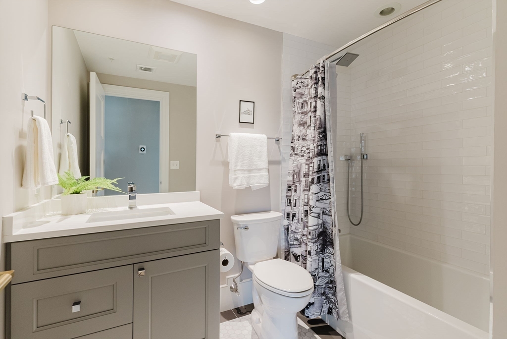 247 D Street, Unit 8 Boston, MA 02127 - Photo 36 of 42 a bathroom with a sink a toilet and shower