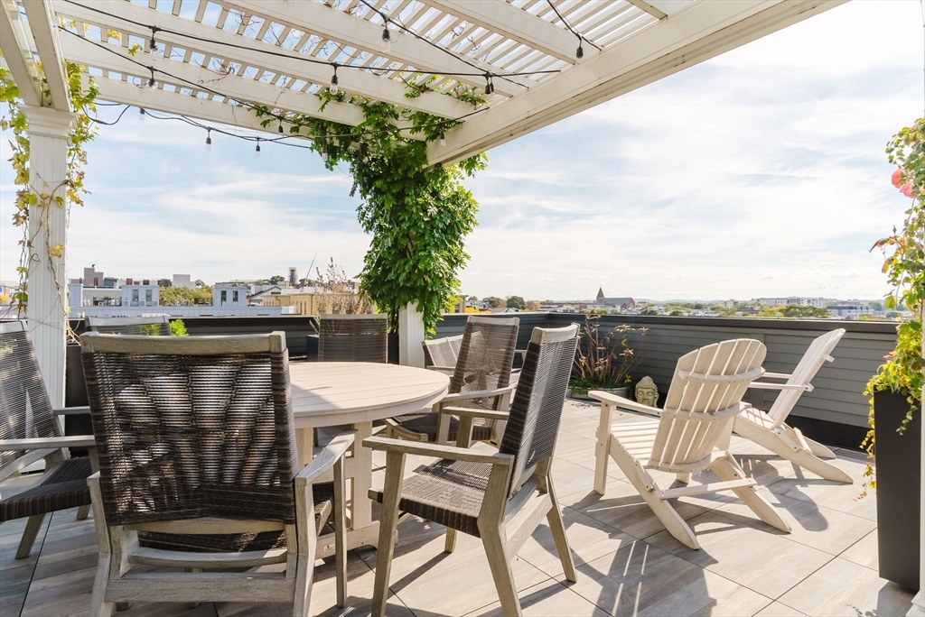 247 D Street, Unit 8 Boston, MA 02127 - Photo 39 of 42 a view of a terrace with furniture