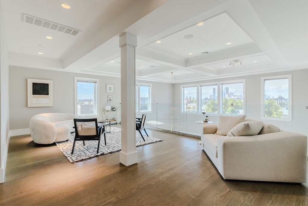 247 D Street, Unit 8 Boston, MA 02127 - Photo 7 of 42 a living room with furniture and a large window