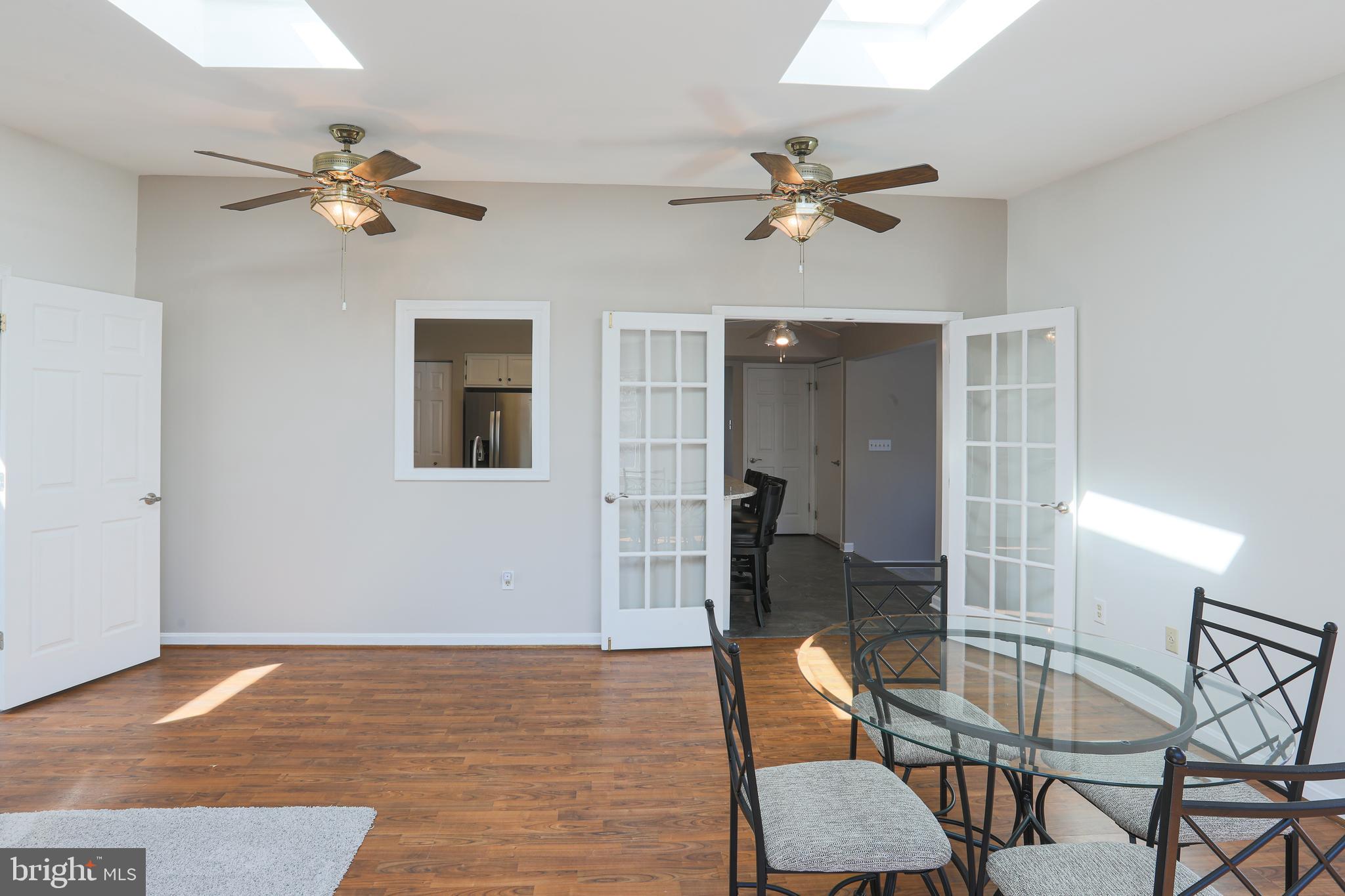 9547 Hallhurst Road Baltimore, MD 21236 - Photo 20 of 49 a view of a livingroom with furniture and a ceiling fan