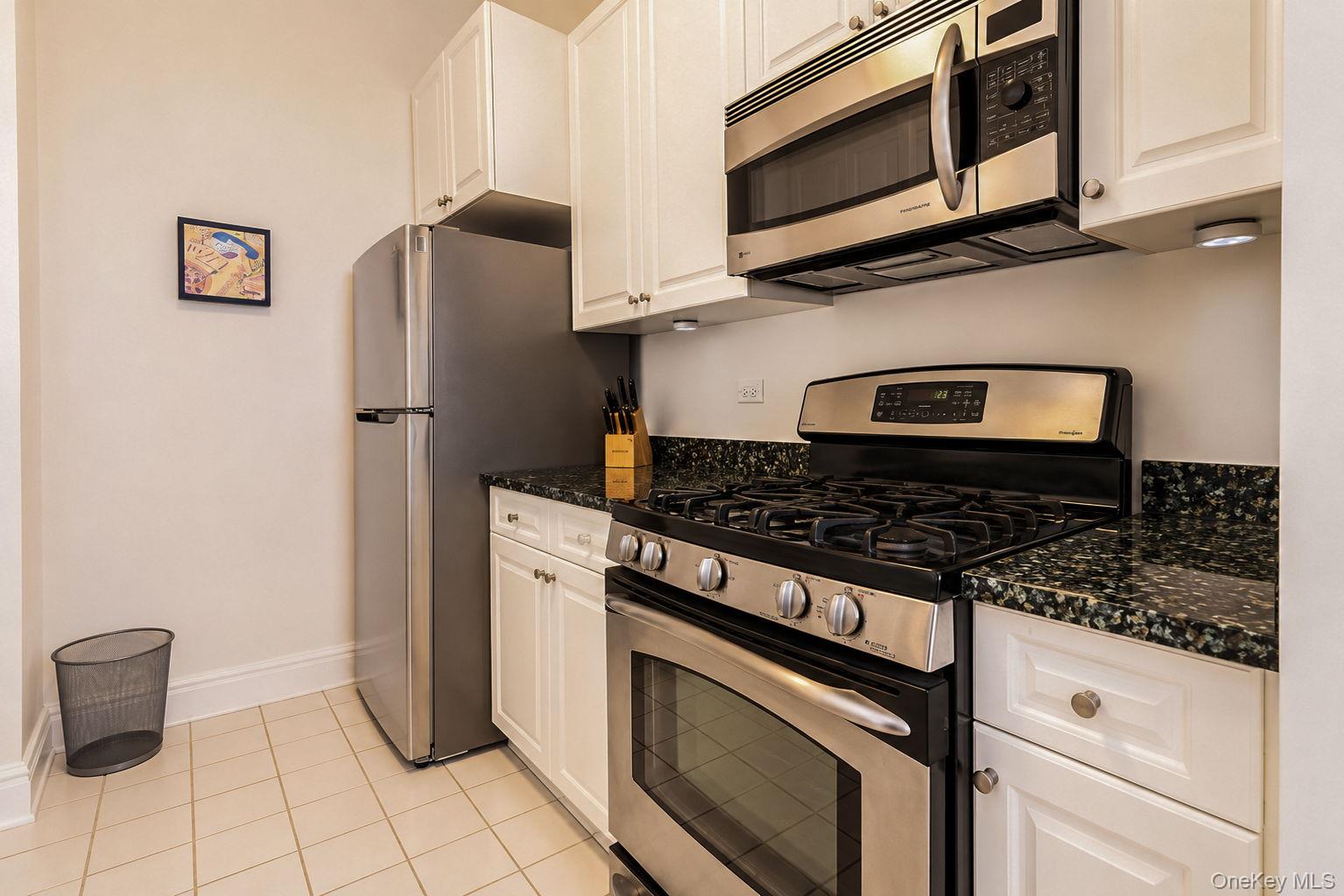 1 Scarsdale Road, Unit 409 Tuckahoe, NY 10707 - Photo 21 of 42 Kitchen with gas range, microwave, refrigerator, dishwasher