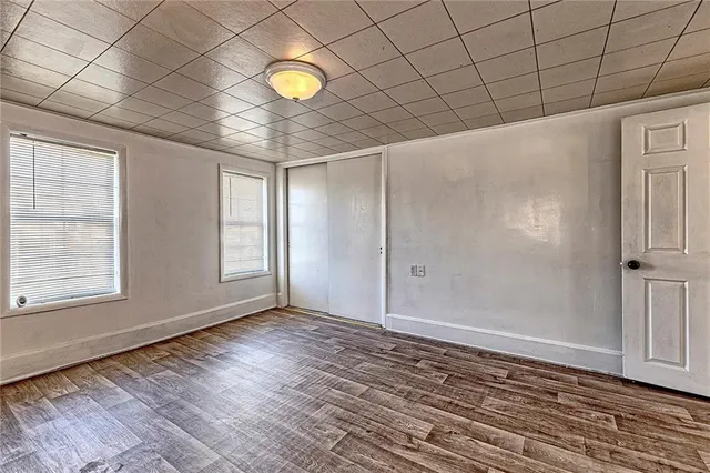 a view of a room with wooden floor