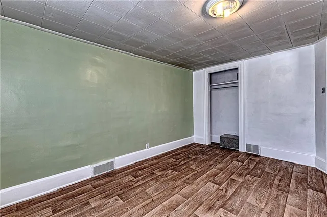 a kitchen with a sink appliances and cabinets