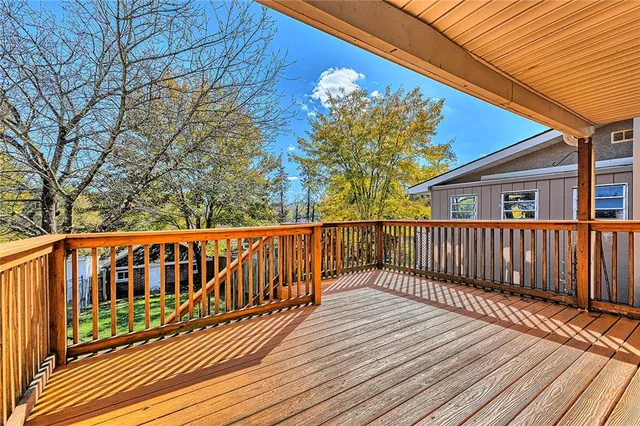 a balcony with a table and chairs