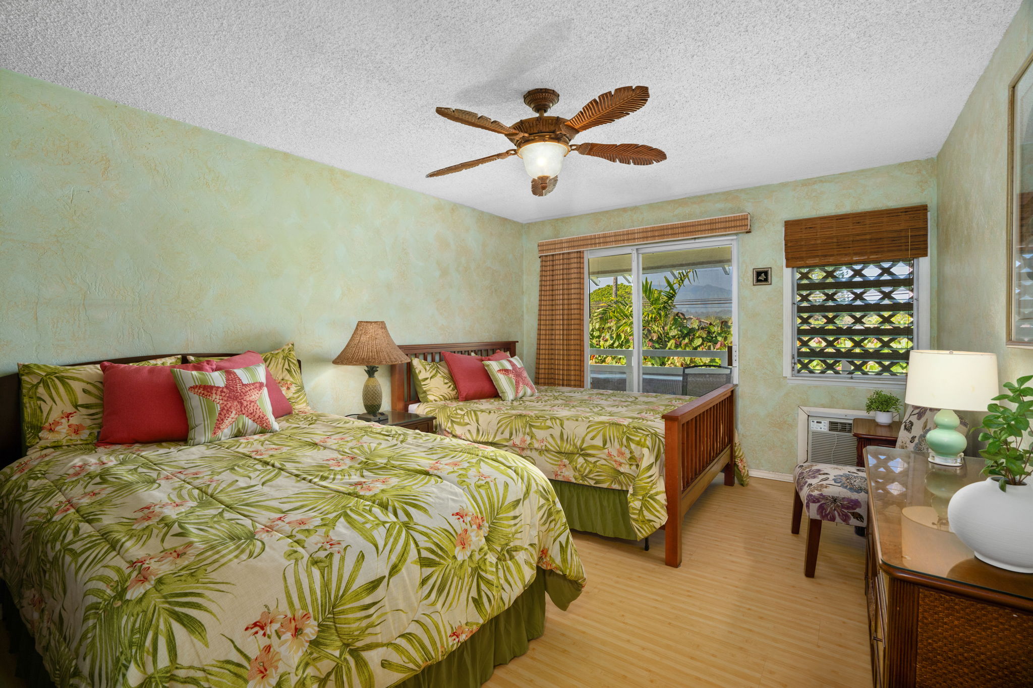 525 Aleka Loop, Unit K12 Kapaa, HI 96746 - Photo 5 of 7 a bed sitting in a bedroom next to a window