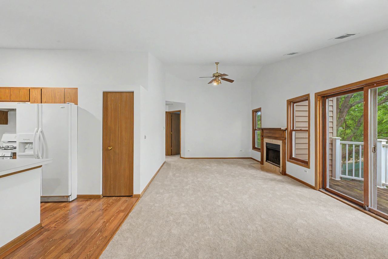 1953 North Coldspring Road Arlington Heights, IL 60004 - Photo 7 of 27 a view of an empty room with a fireplace and a window
