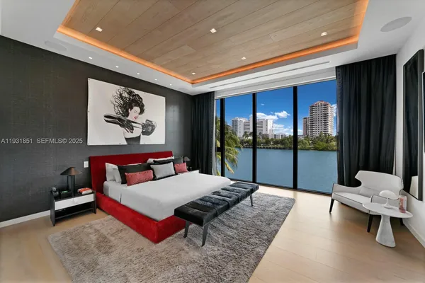 a living room with furniture lamp and large window