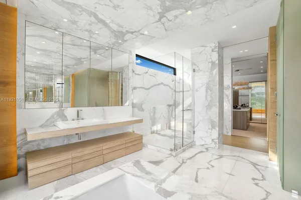 a kitchen with stainless steel appliances granite countertop a stove and cabinets