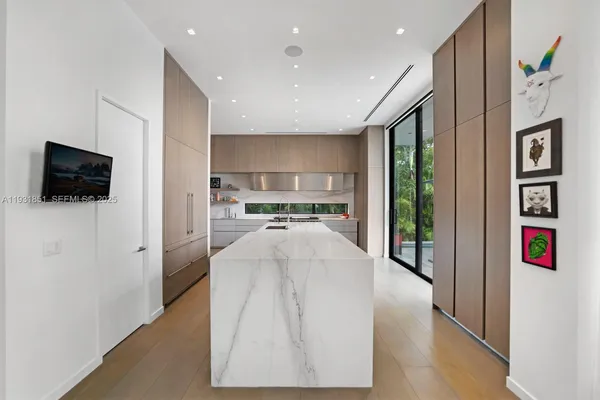 a kitchen with a sink and a stove top oven