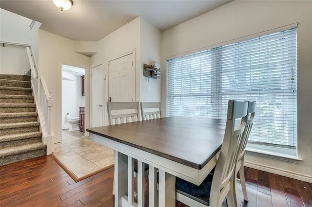 an open kitchen with a table and chairs
