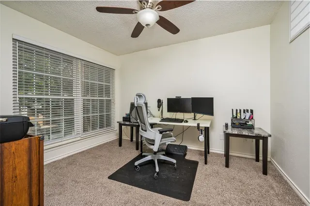 a workspace with furniture and a window