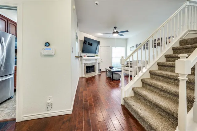 a view of entryway and workspace with wooden floor