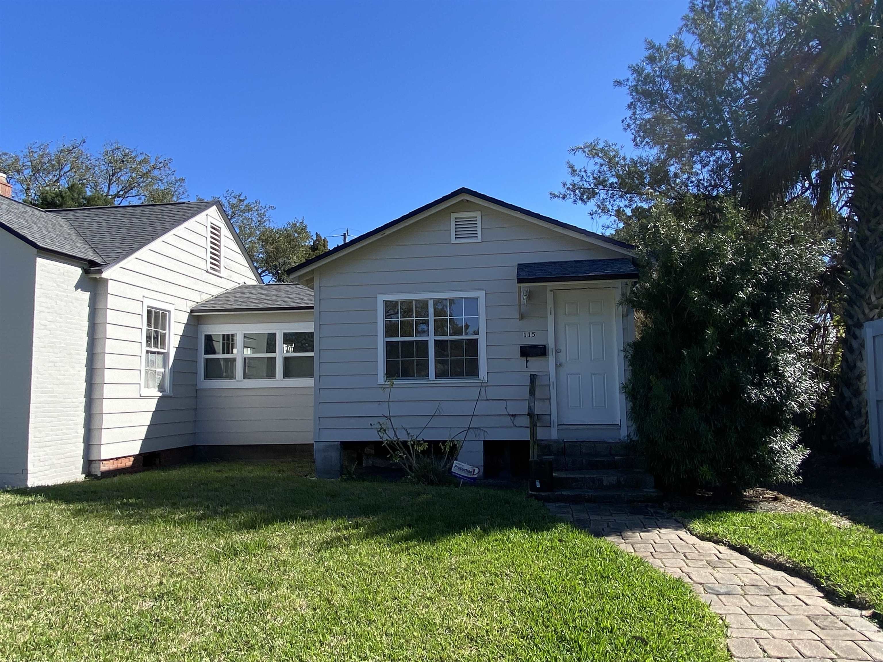 115 Oglethorpe Boulevard, Unit B St. Augustine, FL 32080 - Photo 2 of 7 a front view of a house with a garden