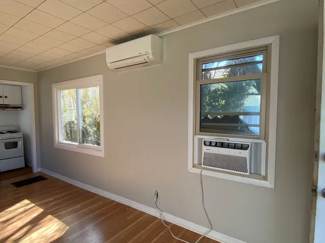 a room with a bed and a window