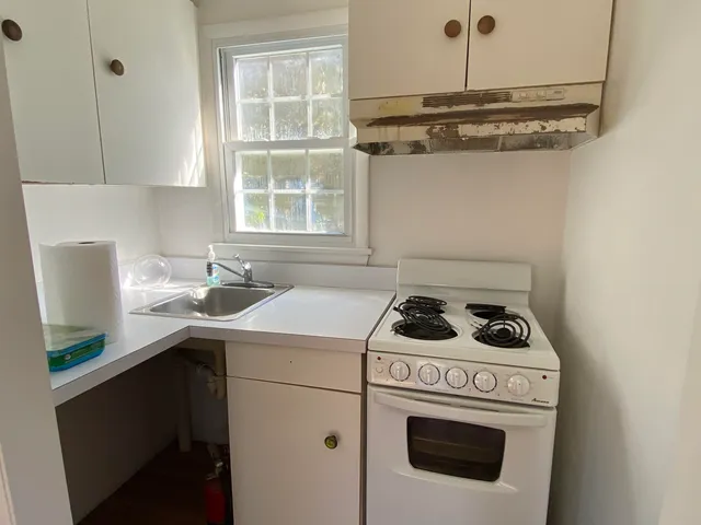 a kitchen with a stove and a sink