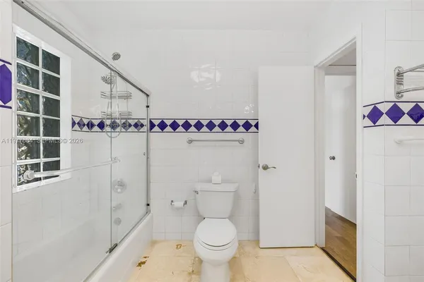 a view of a room with wooden floor and natural light