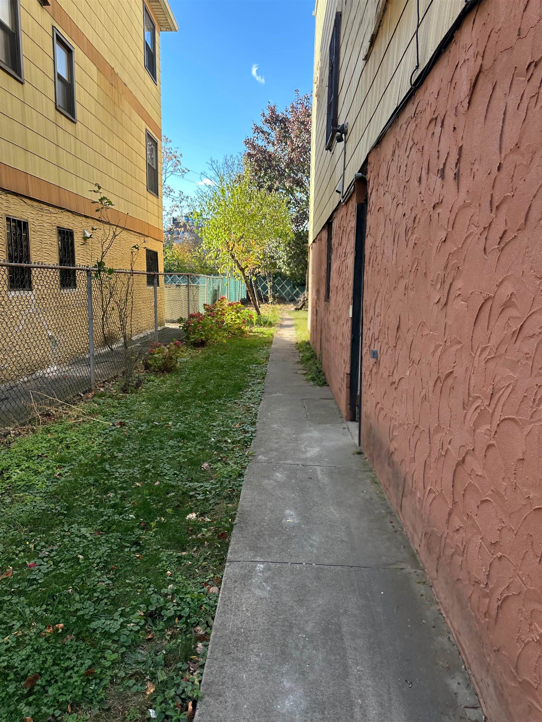 367 Mercer Loop, Unit 2 Jersey City, NJ 07302 - Photo 5 of 8 a view of a pathway with a yard