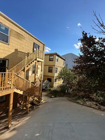 a view of a brick house with a street