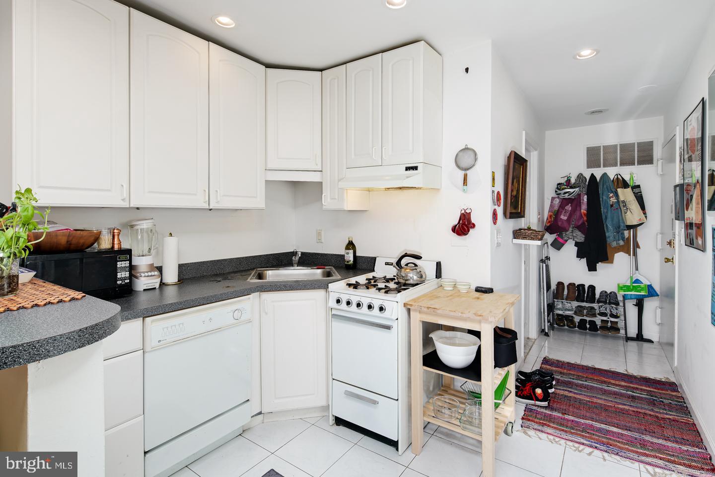 620 South 3rd Street, Unit 3 Philadelphia, PA 19147 - Photo 2 of 11 a kitchen with white cabinets and appliances