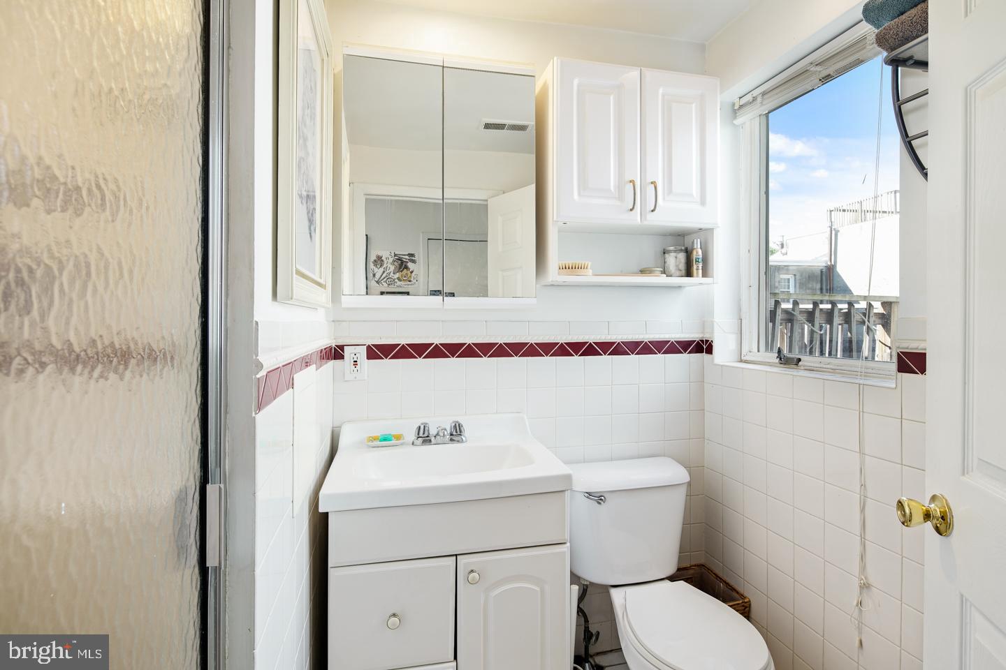 620 South 3rd Street, Unit 3 Philadelphia, PA 19147 - Photo 8 of 11 a bathroom with a sink and a mirror