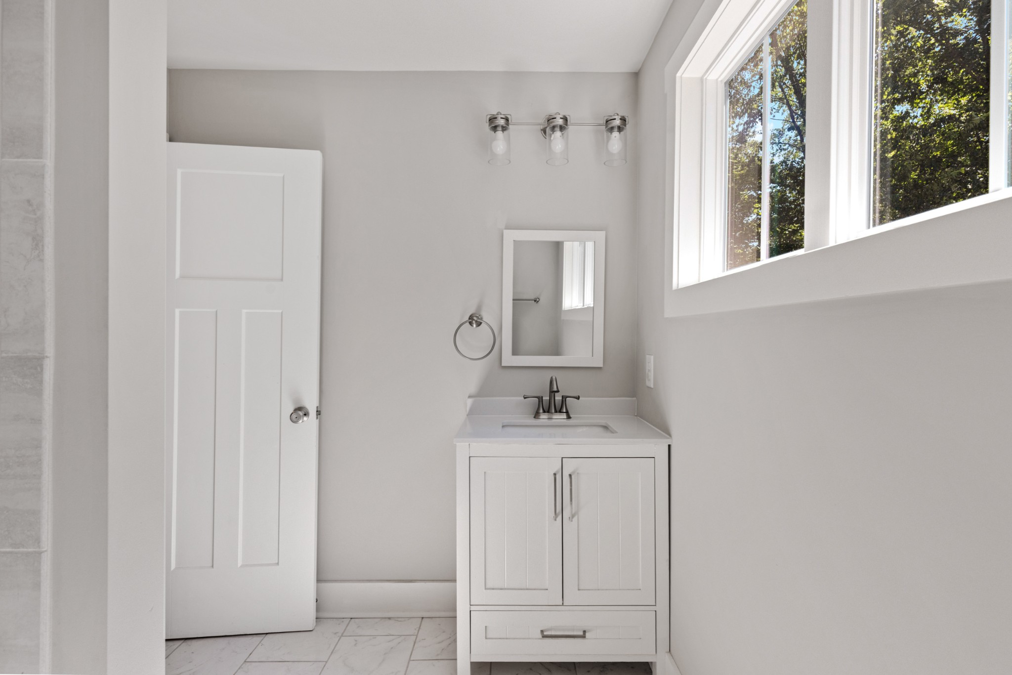 115 North Adams Street Adams, TN 37010 - Photo 32 of 44 a bathroom with a sink and a mirror