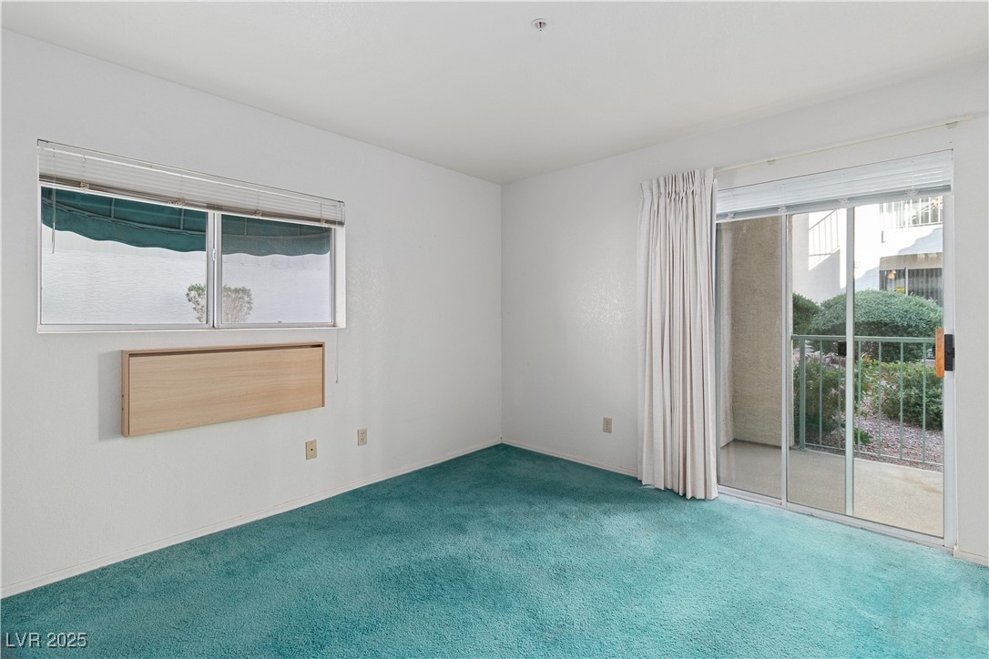 3550 Bay Sands Drive, Unit 1050 Laughlin, NV 89029 - Photo 15 of 71 Primary bedroom featuring carpet flooring and baseboards