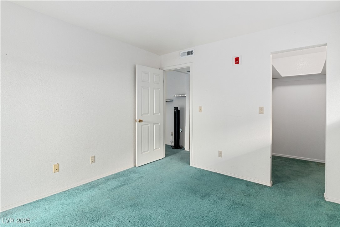 3550 Bay Sands Drive, Unit 1050 Laughlin, NV 89029 - Photo 17 of 71 Primary bedroom featuring a walk in closet and carpet