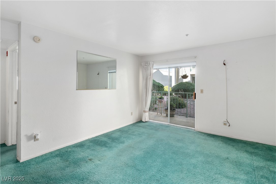 3550 Bay Sands Drive, Unit 1050 Laughlin, NV 89029 - Photo 6 of 71 Carpeted living room with baseboards