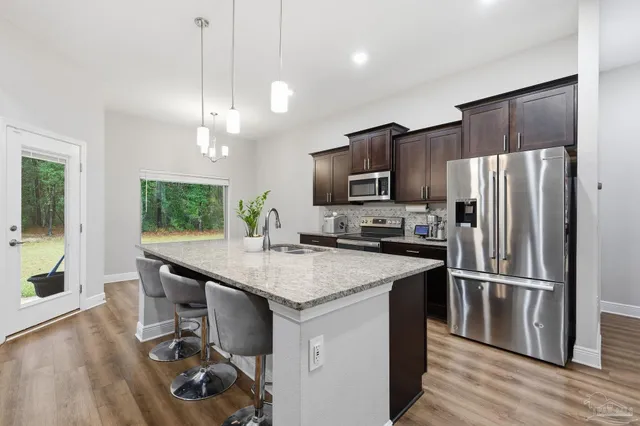 a view of a lake with trees in the background