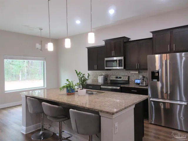 a view of a golf course with a lake view