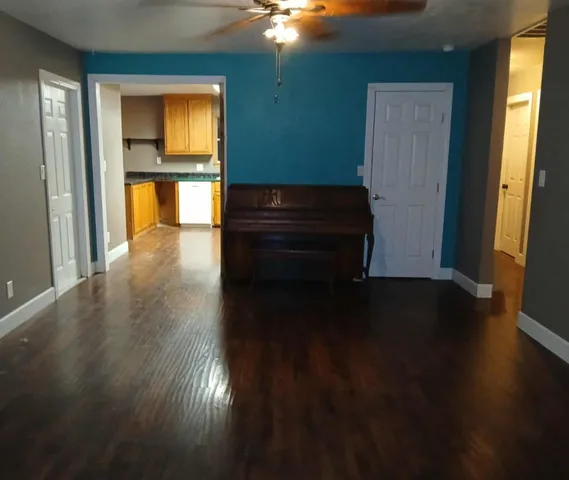 a room with wooden floor and a window