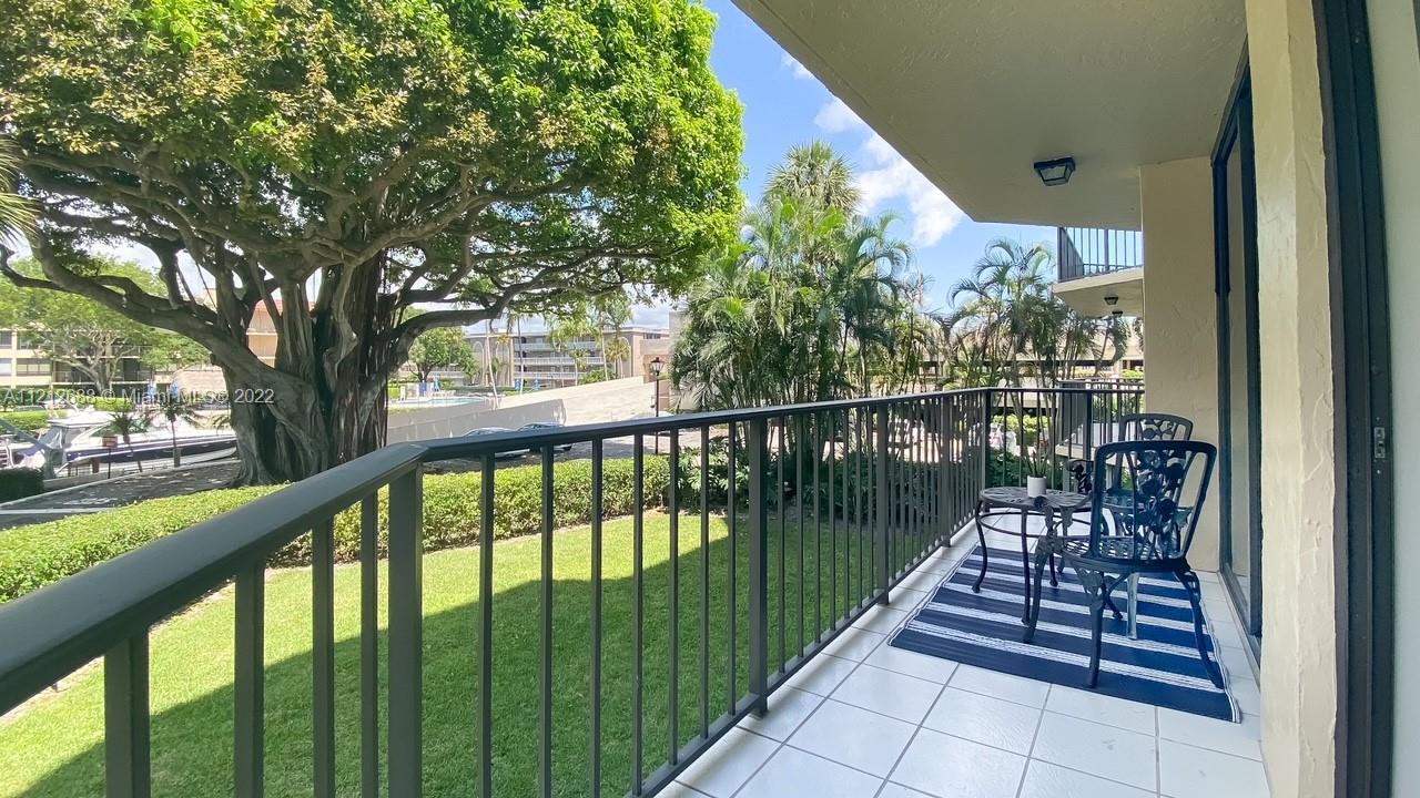 859 Jeffery Street, Unit 201 Boca Raton, FL 33487 - Photo 23 of 33 a view of balcony with wooden floor