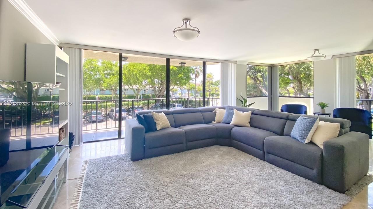 859 Jeffery Street, Unit 201 Boca Raton, FL 33487 - Photo 6 of 33 a living room with furniture and a large window