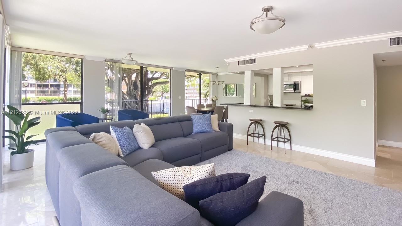 859 Jeffery Street, Unit 201 Boca Raton, FL 33487 - Photo 7 of 33 a living room with furniture and a large window