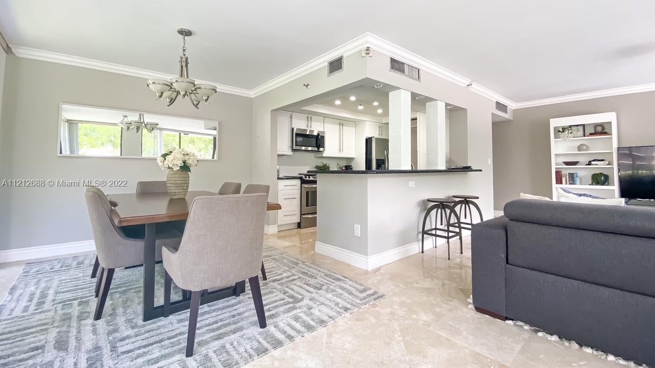 859 Jeffery Street, Unit 201 Boca Raton, FL 33487 - Photo 10 of 33 a view of a dining room with furniture