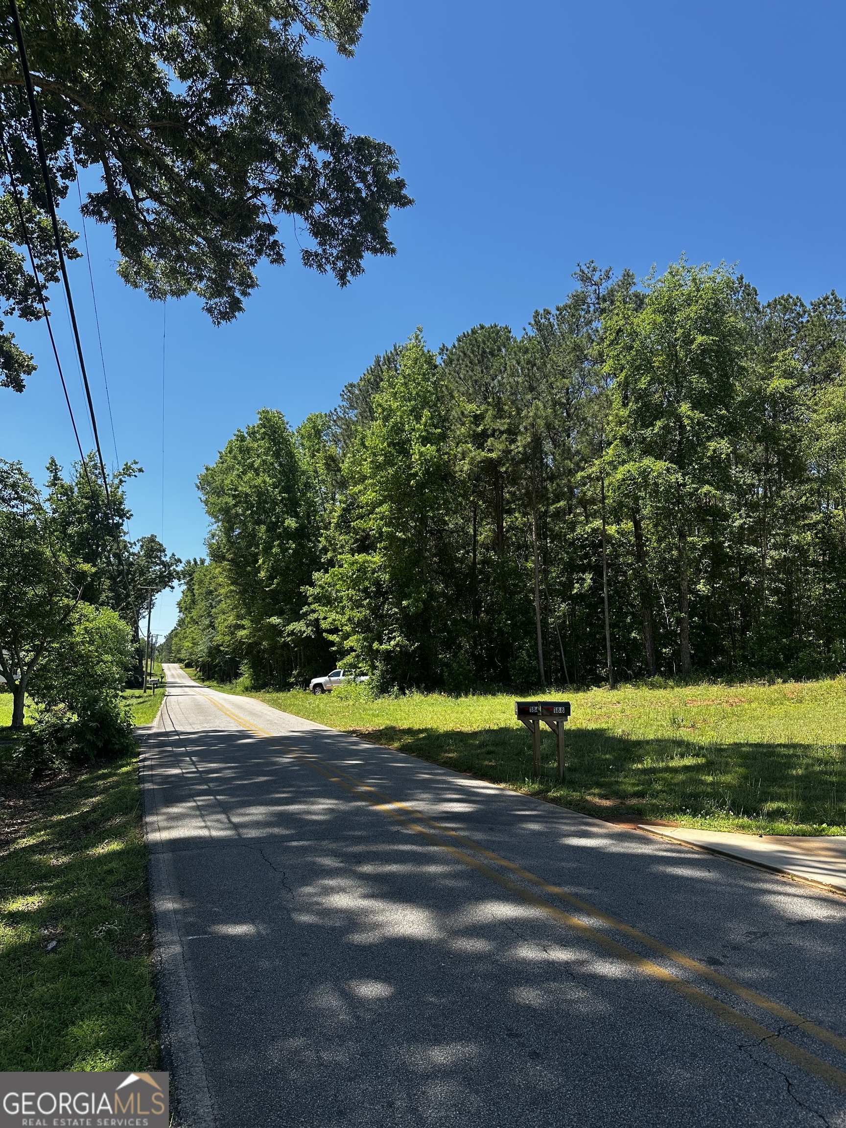 178 Barnesville Avenue Barnesville, GA 30204 - Photo 6 of 17 a view of a golf course with a lake