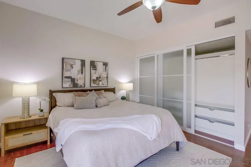 14747 Dash Way Poway, CA 92064 - Photo 20 of 65 a bedroom with a bed and a lamp on dresser